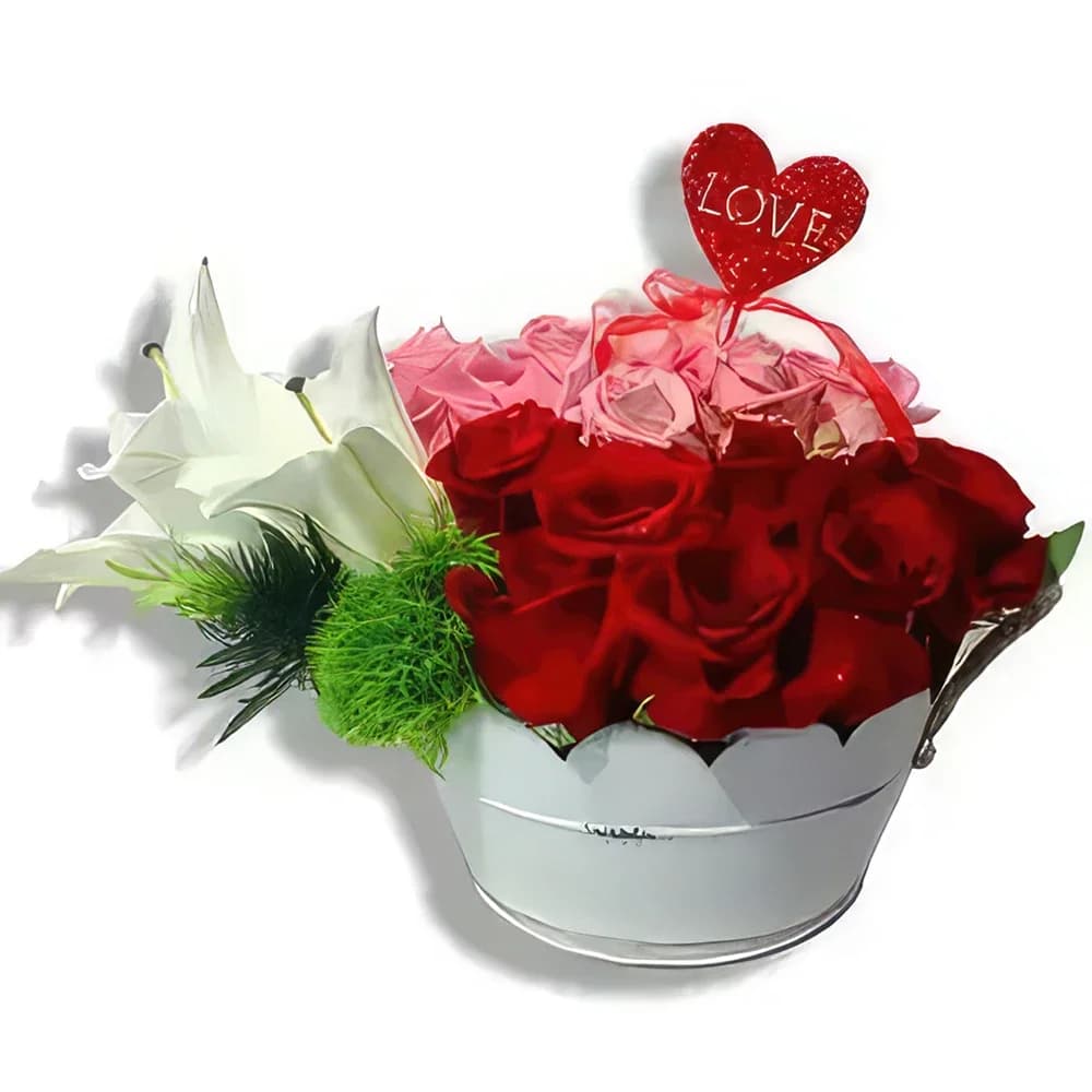 Composizione di rose e gigli in vaso